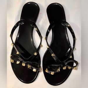 BRAND NEW Betsey Johnson bow-tie, gold studded, black flip flops. Size 9!